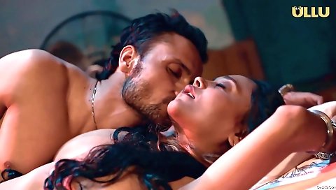 Brunette babe with a nice smile and a beautiful face is on a laptop