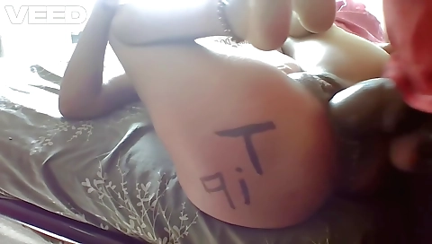 Indian milf sucks and gets her pussy wet with a white dildo