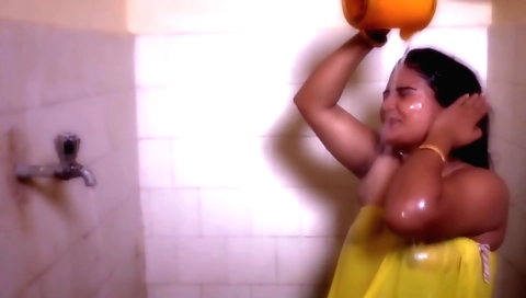 Horny chick with big tits is in a bath shower and stripping naked