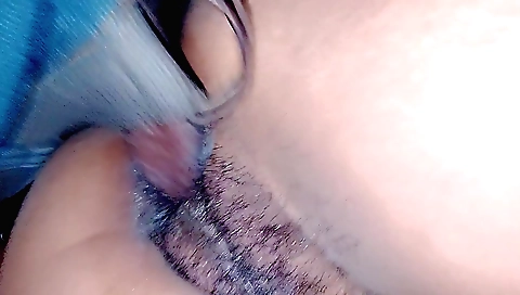 Indian girl with a hairy pussy is laying on her bed