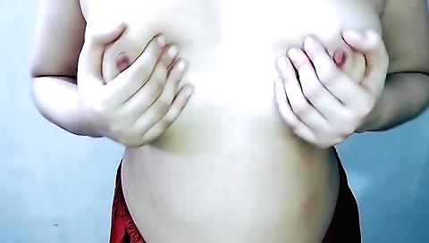 Sexy chick wearing red dress shows her face on webcam