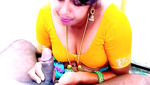 Indian maid with big tits sucks a guy off in a bed