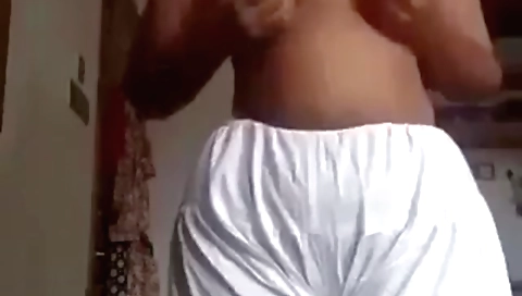 Busty brunette stripper gets captured in a solo clip