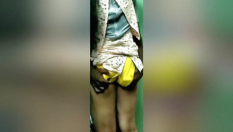 Indian girl is in the room with the camera and she is showing