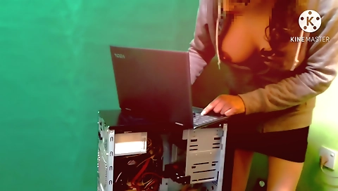 Beautiful Indian girl fixes her computer in a sexy dress