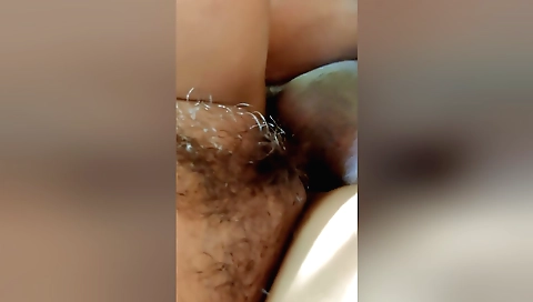 Busty woman in black dress riding a cock in her hairy bush