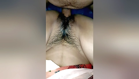 Indian hairy chick makes her lover's hard cock for a blowjob