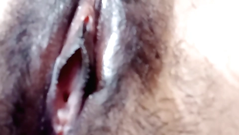 Sexy indian woman with a hairy pussy enjoys alone in her bed