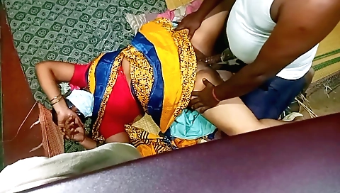 A brunette in a blue blouse gives her student a blowjob and a dick