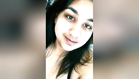 Sexy amateur brunette shows her nice boobs and legs