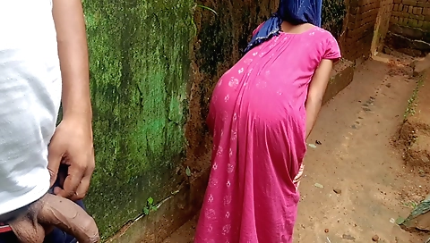 A hairy girl on the bed is stripping naked and masturbating